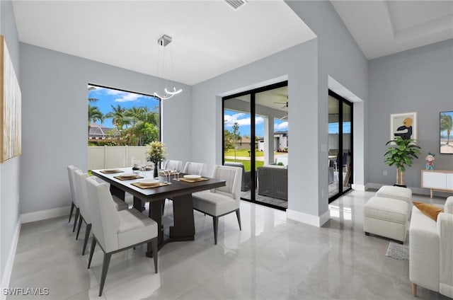 2218 SW 25th St, Cape Coral, FL 33914 - dining room featuring a chandelier and baseboards