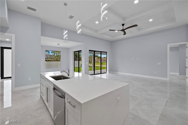 2218 SW 25th St, Cape Coral, FL 33914 - kitchen with dishwasher, ceiling fan, recessed lighting, coffered ceiling, and a kitchen island with sink