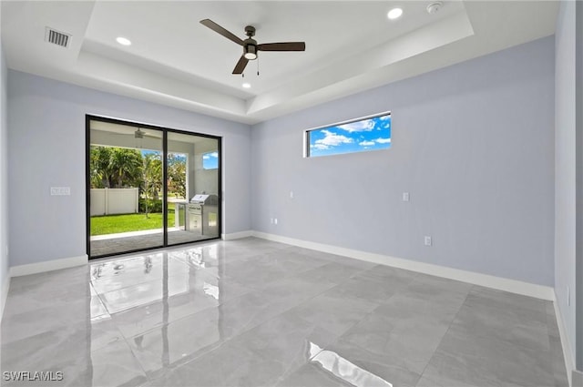 2218 SW 25th St, Cape Coral, FL 33914 - unfurnished room with a raised ceiling, healthy amount of natural light, ceiling fan, recessed lighting, and a smoke detector