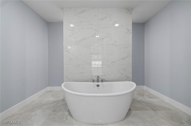 2218 SW 25th St, Cape Coral, FL 33914 - full bathroom with marble tiled flooring and a soaking tub