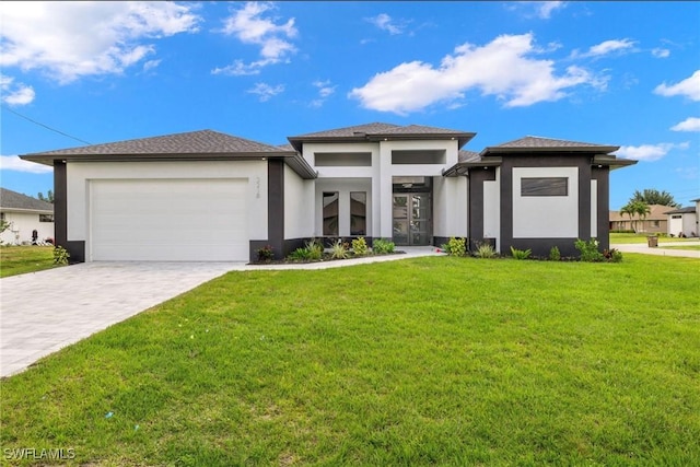 2218 SW 25th St, Cape Coral, FL 33914 - prairie-style home with stucco siding, a front lawn, a garage, and decorative driveway