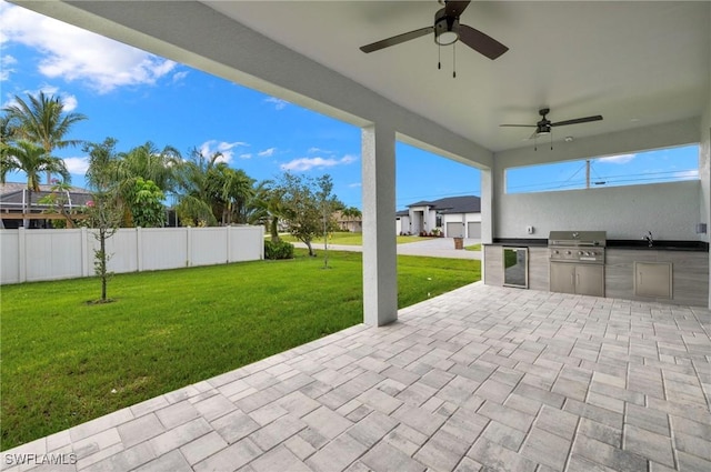 2218 SW 25th St, Cape Coral, FL 33914 - view of patio with an outdoor kitchen and ceiling fan