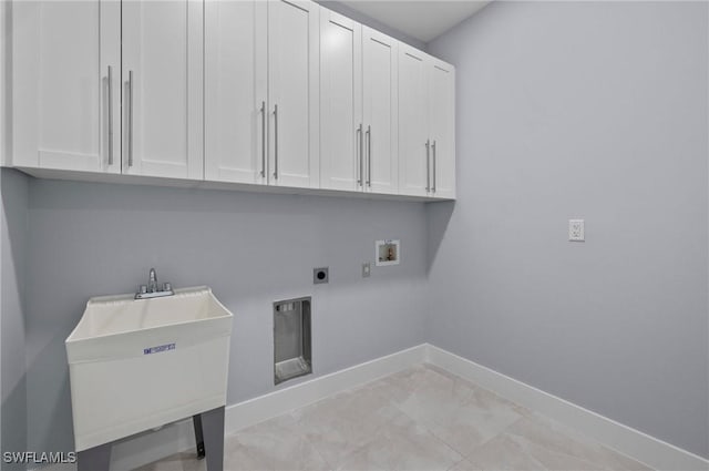 2218 SW 25th St, Cape Coral, FL 33914 - washroom featuring cabinet space, washer hookup, electric dryer hookup, and light marble finish floors