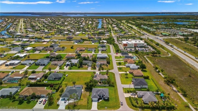 2218 SW 25th St, Cape Coral, FL 33914 - aerial view of property's location featuring a large body of water and nearby suburban area