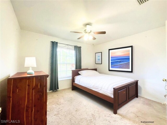 836 Dawhert Ave S, Lehigh Acres, FL 33974 - bedroom with light colored carpet and a ceiling fan