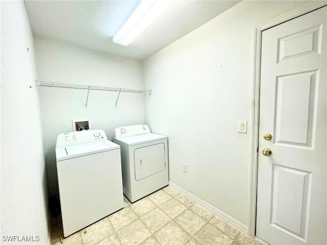 836 Dawhert Ave S, Lehigh Acres, FL 33974 - laundry area with washing machine and clothes dryer and light flooring
