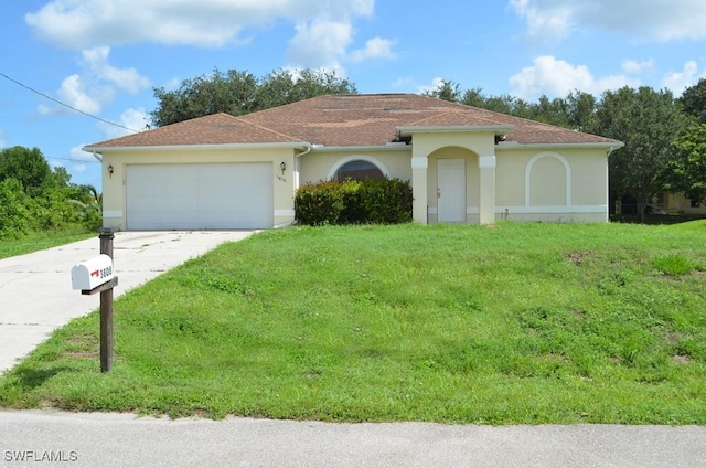 3808 27th St SW, Lehigh Acres, FL 33976 - view of front of property with stucco siding, driveway, an attached garage, and a front lawn