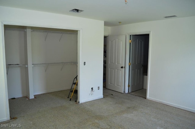 3808 27th St SW, Lehigh Acres, FL 33976 - unfurnished bedroom with carpet and a closet