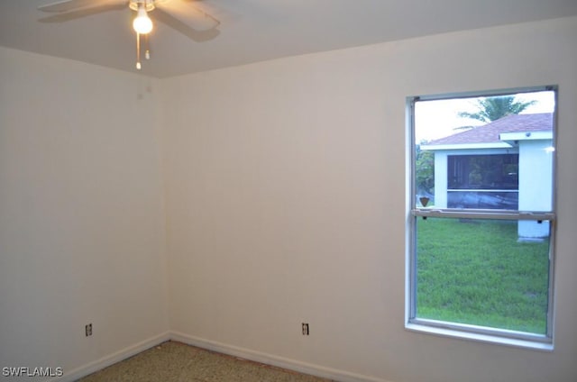 3808 27th St SW, Lehigh Acres, FL 33976 - carpeted spare room featuring baseboards and ceiling fan