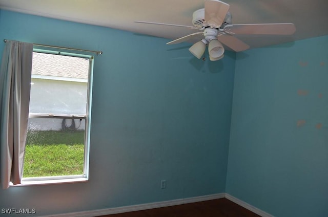3808 27th St SW, Lehigh Acres, FL 33976 - unfurnished room with baseboards and ceiling fan