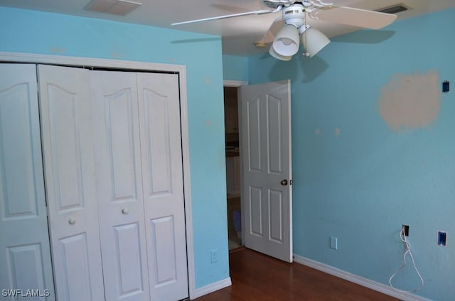 3808 27th St SW, Lehigh Acres, FL 33976 - unfurnished bedroom featuring a closet, wood finished floors, and ceiling fan