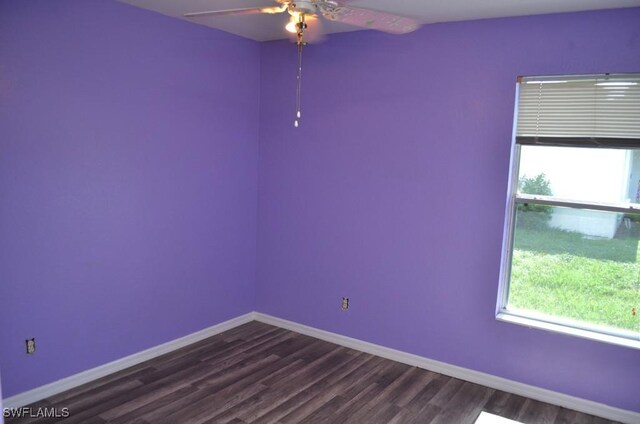 3808 27th St SW, Lehigh Acres, FL 33976 - spare room with a ceiling fan and dark wood-type flooring