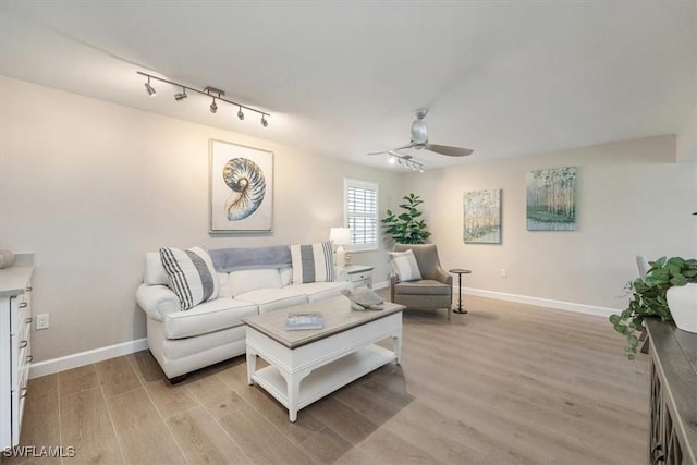 626 12th Ave S Unit 626, Naples, FL 34102 - living room featuring ceiling fan, light wood-type flooring, and rail lighting