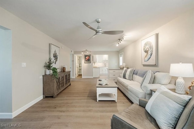 626 12th Ave S Unit 626, Naples, FL 34102 - living room with a ceiling fan and light wood-style flooring
