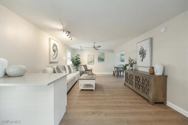 626 12th Ave S Unit 626, Naples, FL 34102 - living area with ceiling fan, light wood-style flooring, and track lighting