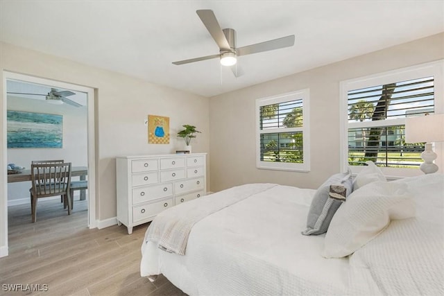 626 12th Ave S Unit 626, Naples, FL 34102 - bedroom with light wood-style flooring and ceiling fan