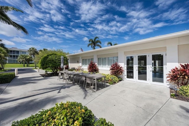 626 12th Ave S Unit 626, Naples, FL 34102 - view of patio / terrace with french doors and outdoor dining space