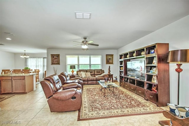 3200 Birch Tree Ln, Alva, FL 33920 - living area with a ceiling fan, light tile patterned flooring, and a chandelier