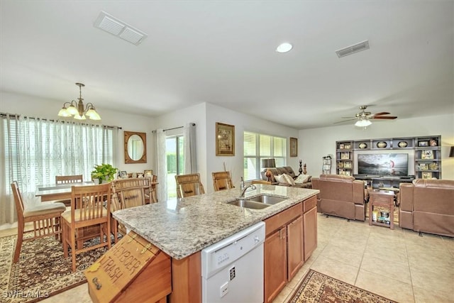 3200 Birch Tree Ln, Alva, FL 33920 - kitchen featuring white dishwasher, a chandelier, open floor plan, light stone countertops, and light tile patterned floors