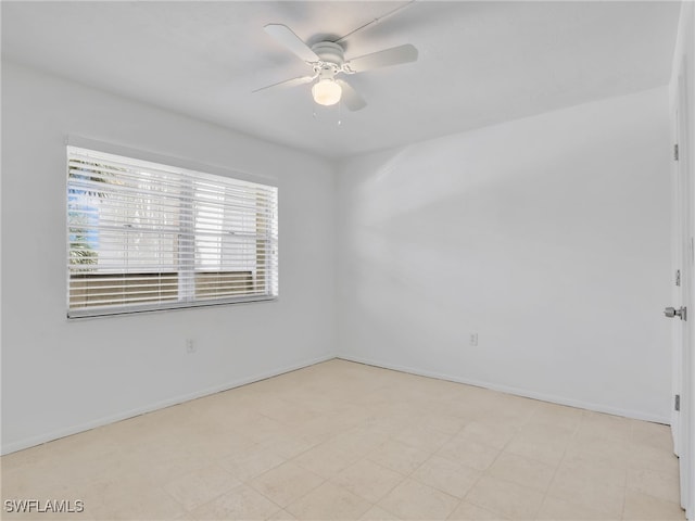 499 Forest Lakes Blvd Unit 207, Naples, FL 34105 - spare room with a ceiling fan and baseboards