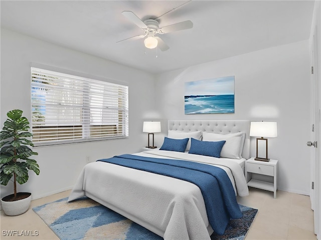 499 Forest Lakes Blvd Unit 207, Naples, FL 34105 - bedroom with a ceiling fan and baseboards