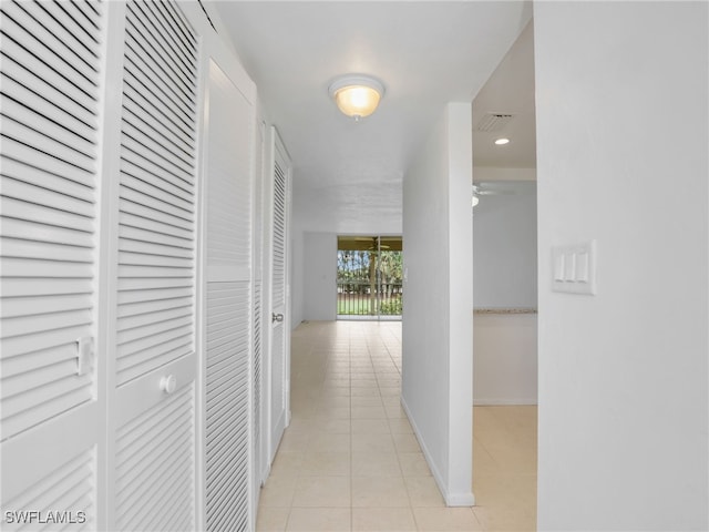 499 Forest Lakes Blvd Unit 207, Naples, FL 34105 - hall featuring light tile patterned flooring and baseboards