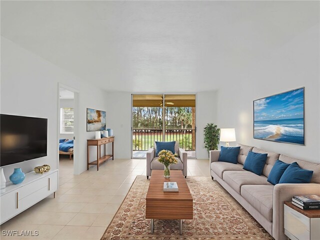 499 Forest Lakes Blvd Unit 207, Naples, FL 34105 - living area featuring light tile patterned floors and plenty of natural light