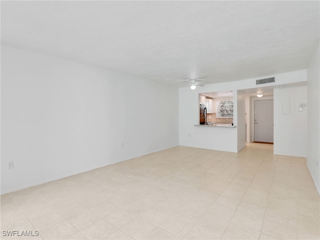 499 Forest Lakes Blvd Unit 207, Naples, FL 34105 - unfurnished living room featuring ceiling fan
