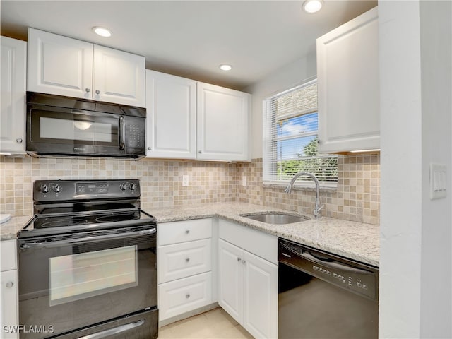 499 Forest Lakes Blvd Unit 207, Naples, FL 34105 - kitchen featuring black appliances, white cabinets, light stone countertops, recessed lighting, and backsplash
