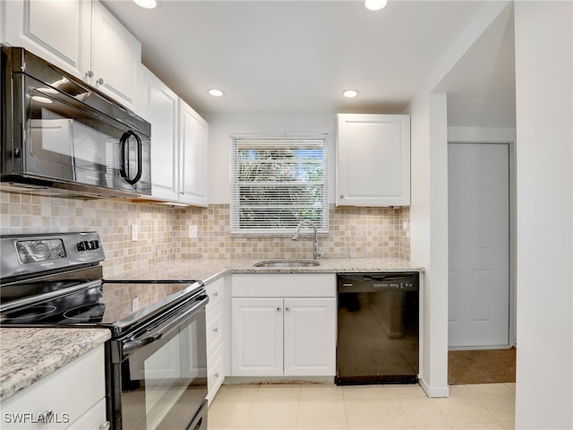499 Forest Lakes Blvd Unit 207, Naples, FL 34105 - kitchen featuring black appliances, white cabinetry, tasteful backsplash, and recessed lighting