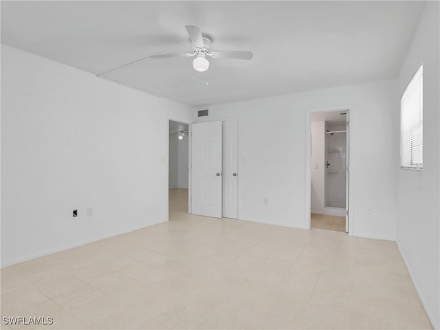 499 Forest Lakes Blvd Unit 207, Naples, FL 34105 - empty room with a ceiling fan and baseboards