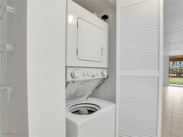499 Forest Lakes Blvd Unit 207, Naples, FL 34105 - laundry room featuring stacked washer and clothes dryer