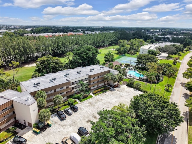 499 Forest Lakes Blvd Unit 207, Naples, FL 34105 - aerial view of a pool and a tree filled landscape
