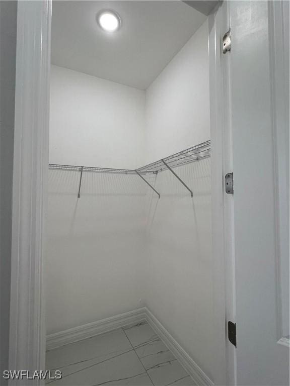 4208 28th St SW, Lehigh Acres, FL 33976 - walk in closet featuring marble finish floors
