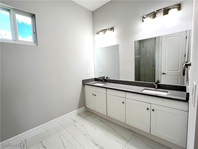 4208 28th St SW, Lehigh Acres, FL 33976 - bathroom featuring marble look tiles, double vanity, and a stall shower