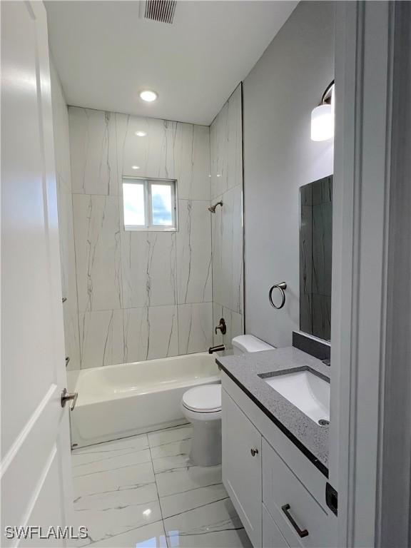 4208 28th St SW, Lehigh Acres, FL 33976 - bathroom with vanity, marble finish flooring, shower / washtub combination, and recessed lighting