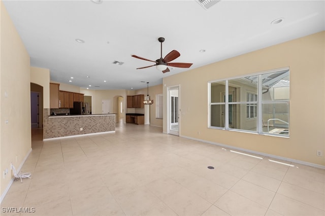 2628 Fairmont Cove Ct, Cape Coral, FL 33991 - unfurnished living room featuring ceiling fan, arched walkways, and recessed lighting
