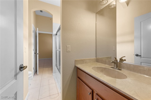 2628 Fairmont Cove Ct, Cape Coral, FL 33991 - bathroom with vanity, tile patterned floors, and enclosed tub / shower combo