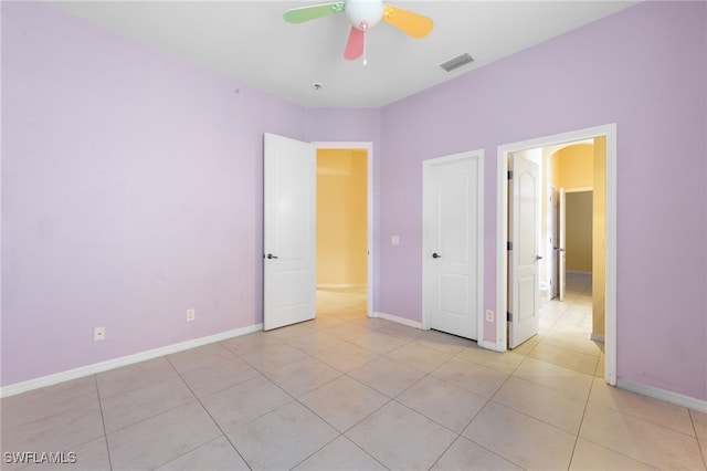 2628 Fairmont Cove Ct, Cape Coral, FL 33991 - unfurnished bedroom featuring light tile patterned floors and ceiling fan
