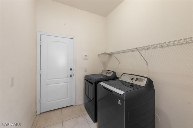 2628 Fairmont Cove Ct, Cape Coral, FL 33991 - laundry area featuring separate washer and dryer and light tile patterned flooring