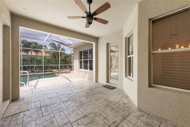 2628 Fairmont Cove Ct, Cape Coral, FL 33991 - view of patio / terrace with a pool with connected hot tub, ceiling fan, and glass enclosure