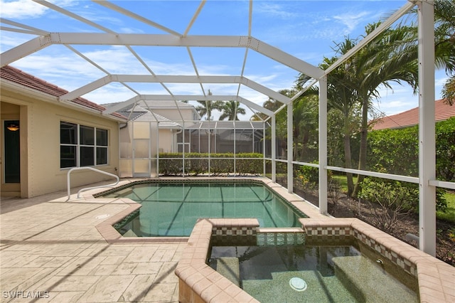 2628 Fairmont Cove Ct, Cape Coral, FL 33991 - view of pool featuring a pool with connected hot tub and a patio area