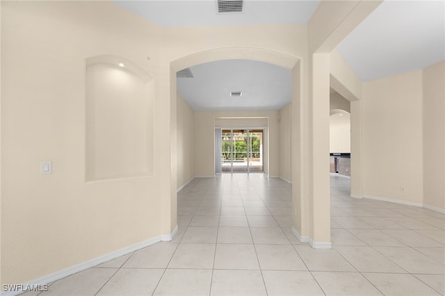 2628 Fairmont Cove Ct, Cape Coral, FL 33991 - hall featuring arched walkways and light tile patterned flooring