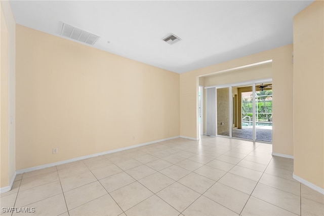 2628 Fairmont Cove Ct, Cape Coral, FL 33991 - unfurnished room with light tile patterned flooring and baseboards