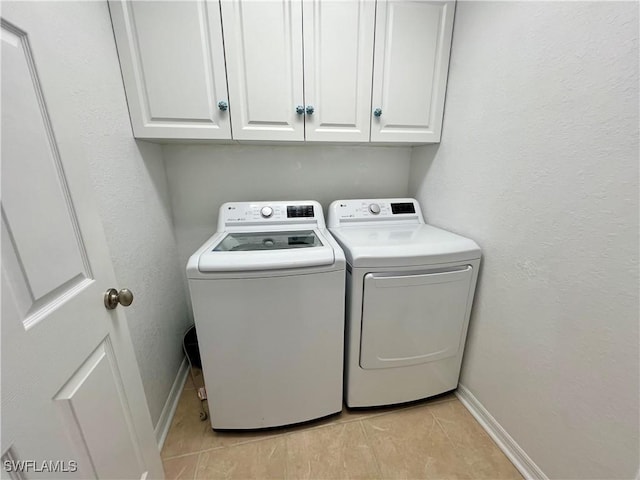 8000 Fountain Mist Blvd, Lehigh Acres, FL 33972 - washroom with independent washer and dryer, light tile patterned floors, and cabinet space
