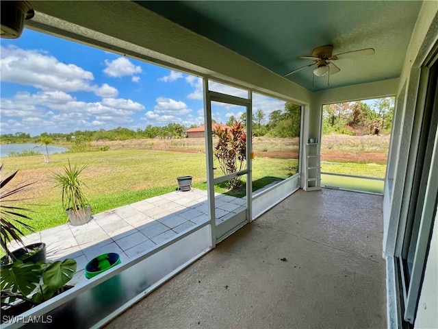 8000 Fountain Mist Blvd, Lehigh Acres, FL 33972 - unfurnished sunroom featuring ceiling fan and a water view