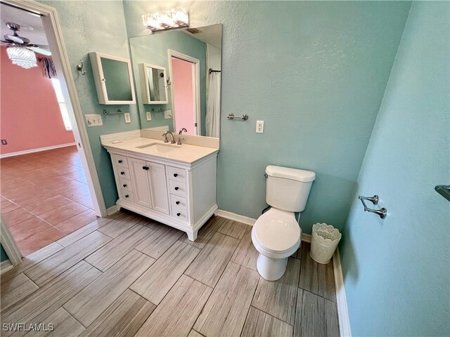 8000 Fountain Mist Blvd, Lehigh Acres, FL 33972 - full bathroom with vanity, wood tiled floors, and ceiling fan