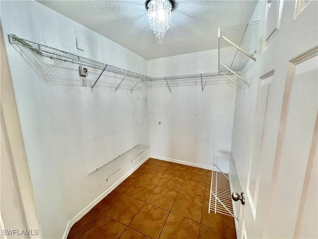 8000 Fountain Mist Blvd, Lehigh Acres, FL 33972 - walk in closet with tile patterned flooring