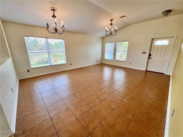 8000 Fountain Mist Blvd, Lehigh Acres, FL 33972 - tiled empty room featuring a chandelier and lofted ceiling