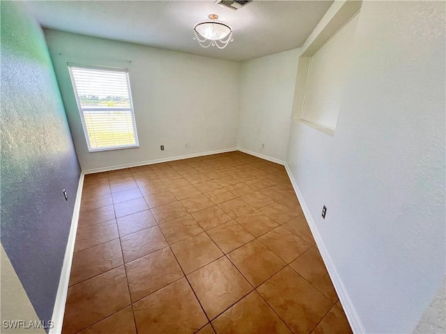 8000 Fountain Mist Blvd, Lehigh Acres, FL 33972 - spare room with tile patterned floors and baseboards